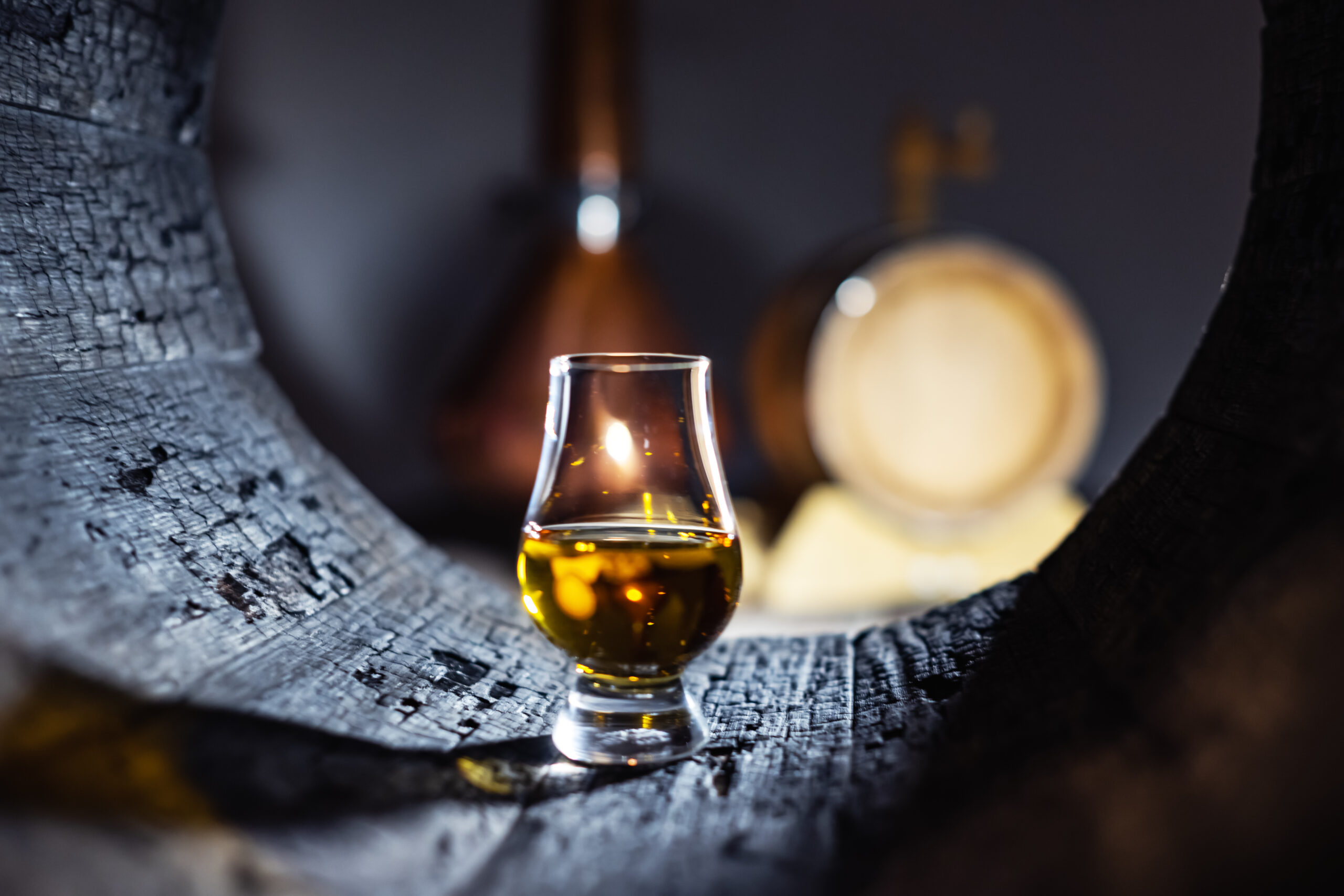 a glass of whiskey in oak barrel 2021 12 17 04 14 08 utc scaled