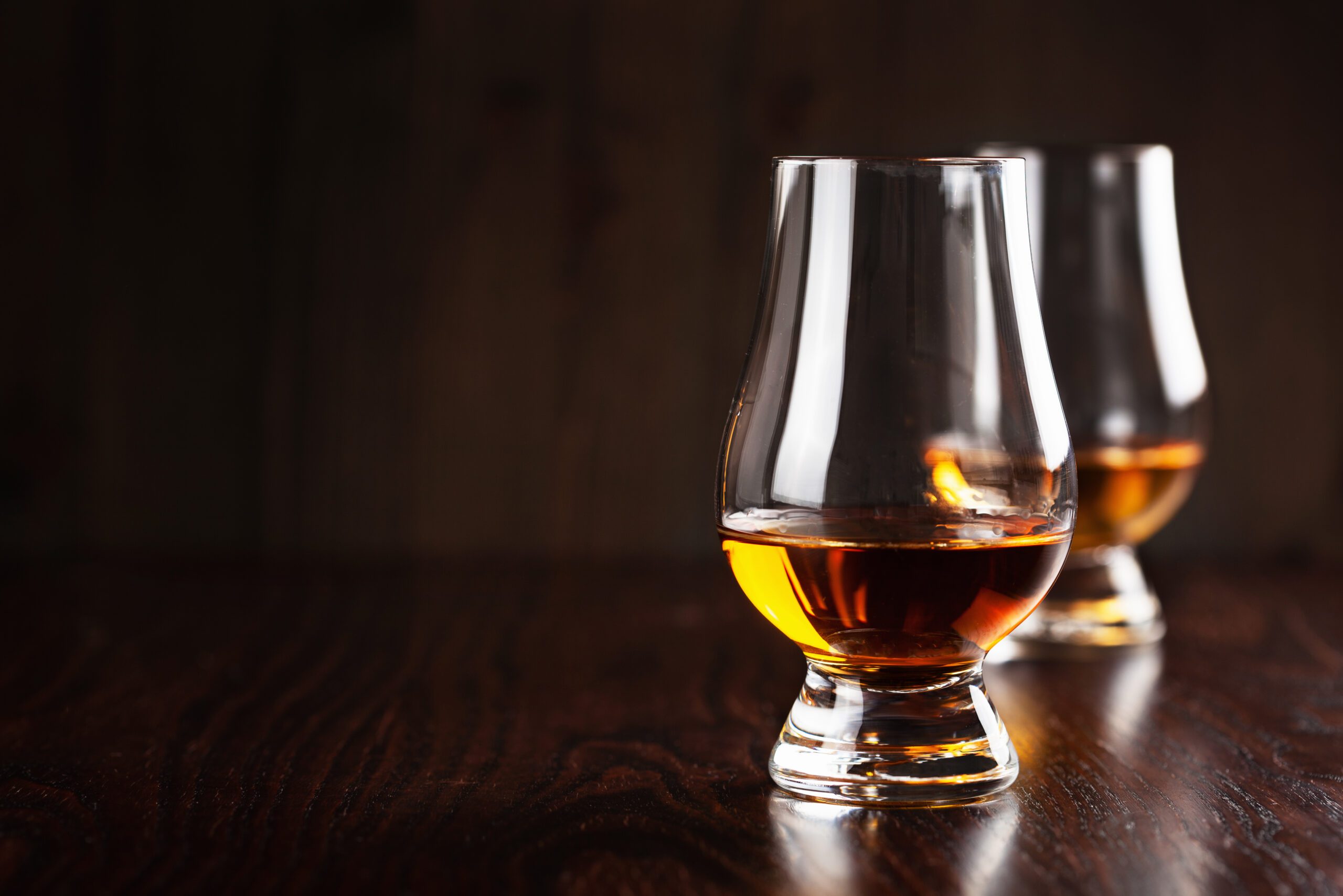 glass of whisky spirit brandy on dark brown background glass of whisky spirit brandy on dark brown backgr 2021 11 03 17 05 20 utc scaled